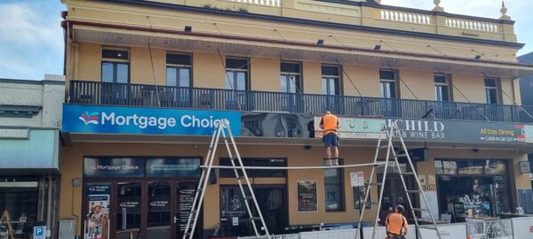 Signage team installing sign in Ipswich Queensland